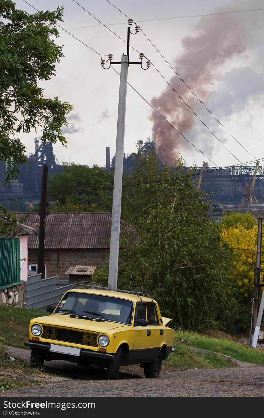 Large metallurgical factory destroying the nature with smoke and waste affecting the people living near. Large metallurgical factory destroying the nature with smoke and waste affecting the people living near