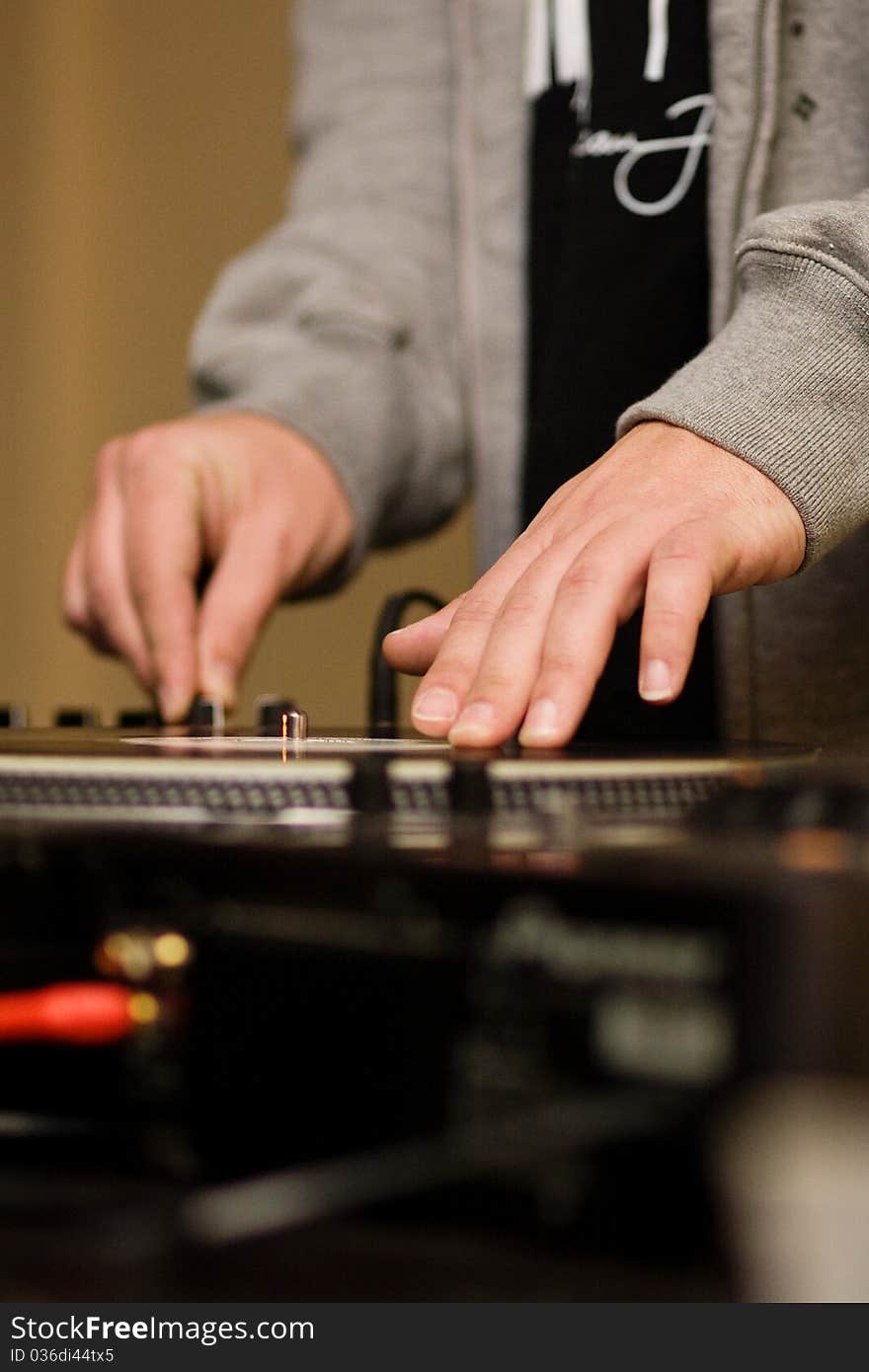 Hands Of A DJ Playing Vinyl