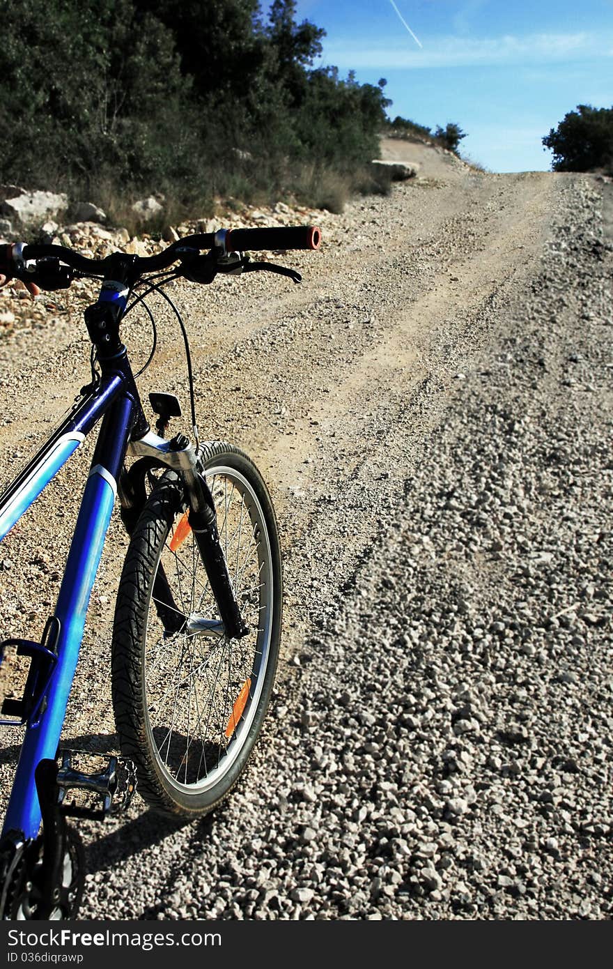 Close up of bicycle on the bottom of the county road. Close up of bicycle on the bottom of the county road.