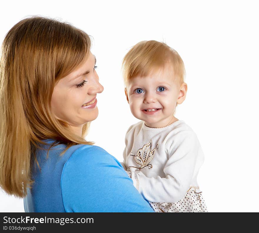 Young mother having fun with her little son on the floor