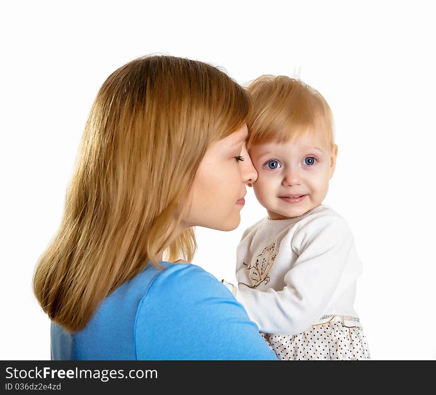 Young mother having fun with her little son on the floor