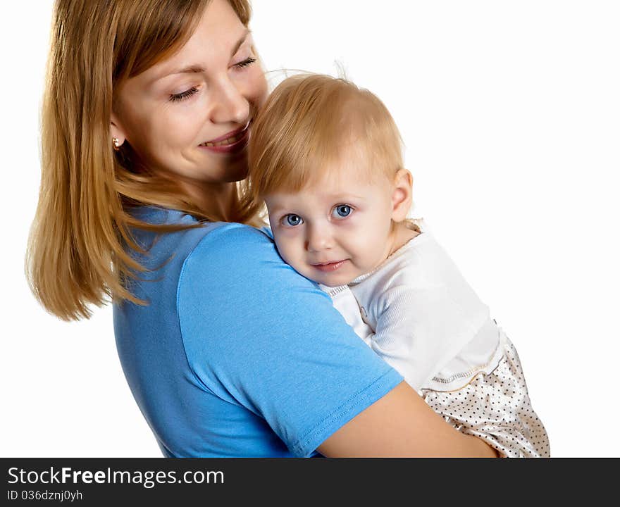 Young mother having fun with her little son on the floor