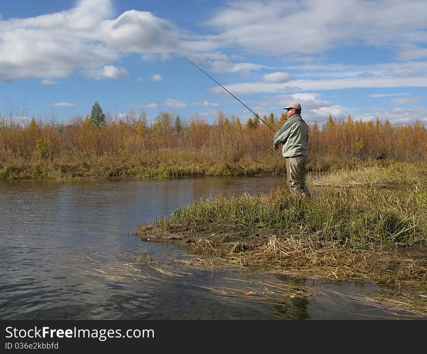 Fishing - fisherman catched fishes on river