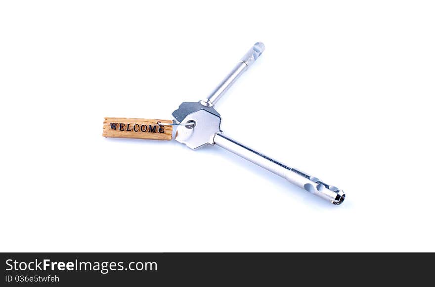 Welcome concept with key and label isolated on white. Welcome concept with key and label isolated on white