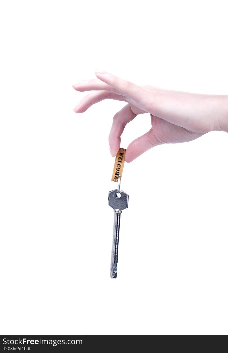 Key from a new house in the hand of woman. Key from a new house in the hand of woman