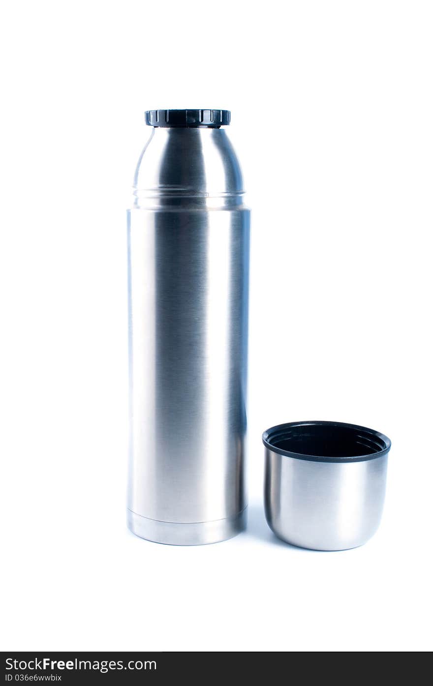 Metal thermos for preservation of a hot or cold liquid on a white background. Metal thermos for preservation of a hot or cold liquid on a white background.