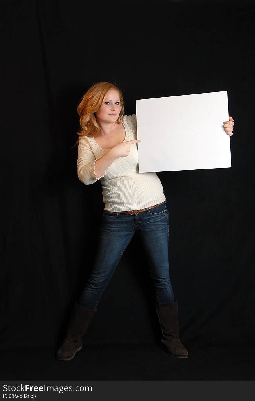 Woman holding blank white placard sign. Woman holding blank white placard sign.