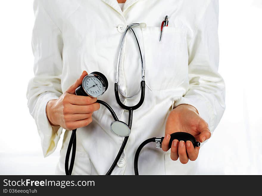 Nurse standing and holding the hearth pressure device in her hands. Nurse standing and holding the hearth pressure device in her hands