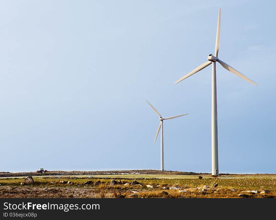 Landscape of wind turbines and little tractor