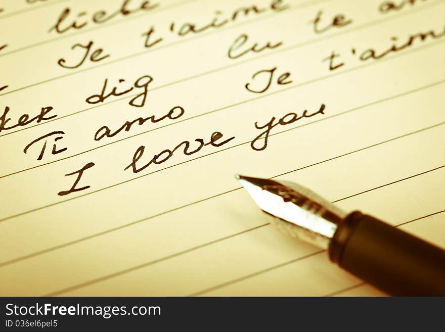 Love phrases on the paper with a pen. Love phrases on the paper with a pen