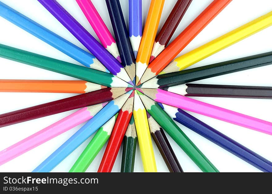 Colorful pencils on white background.