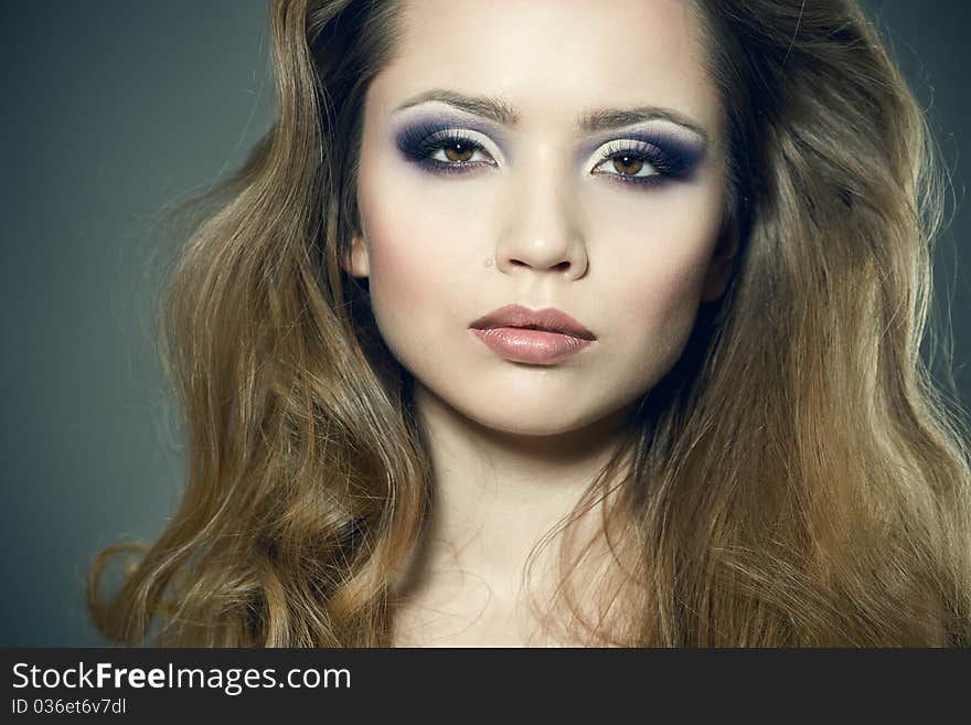 Closeup portrait of a sexy young woman with bright makeup. Closeup portrait of a sexy young woman with bright makeup