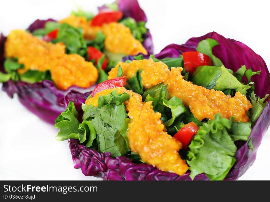 Organic greens in carrot miso dressing