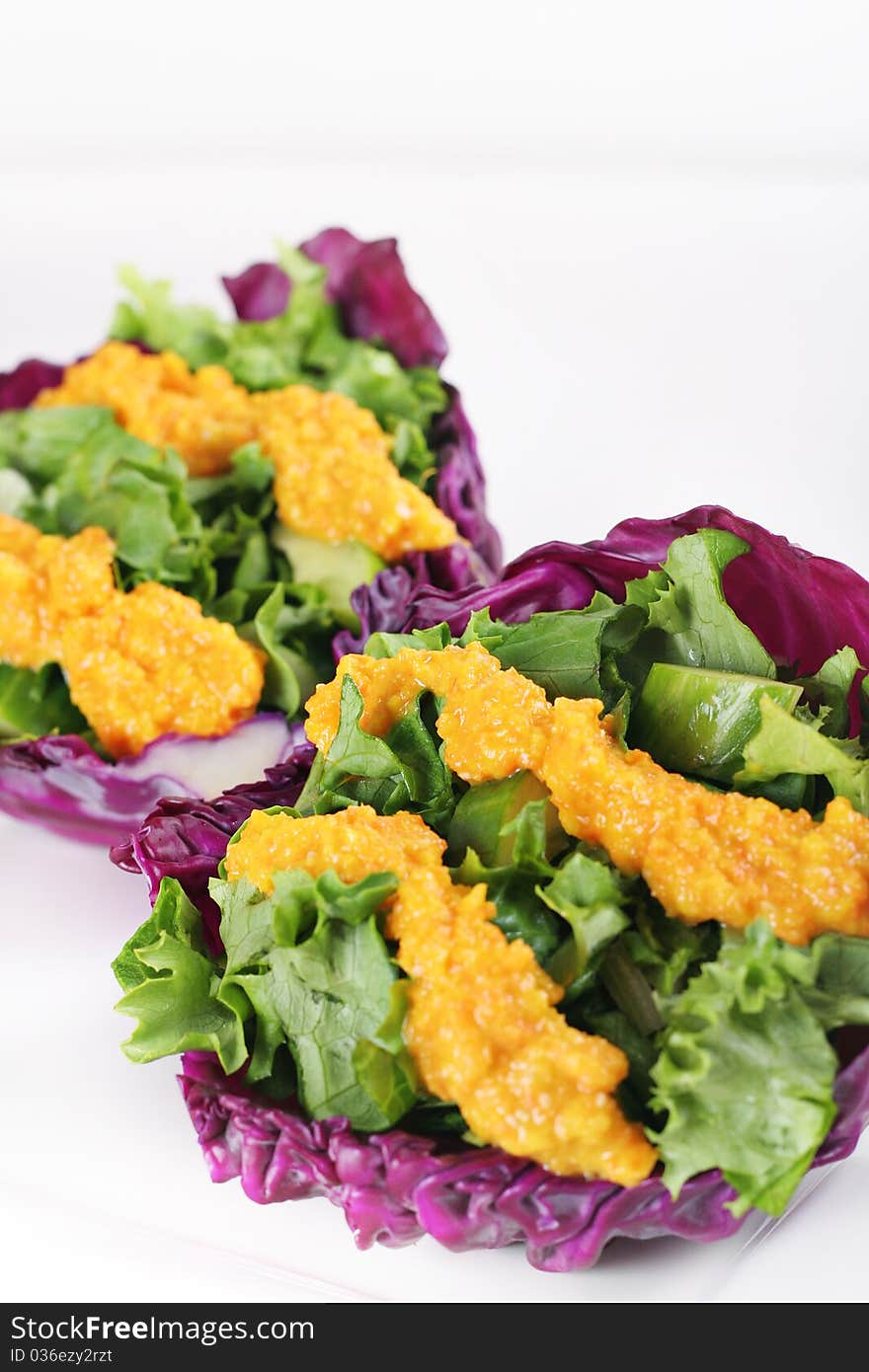 Red cabbage cups with miso carrot dressing