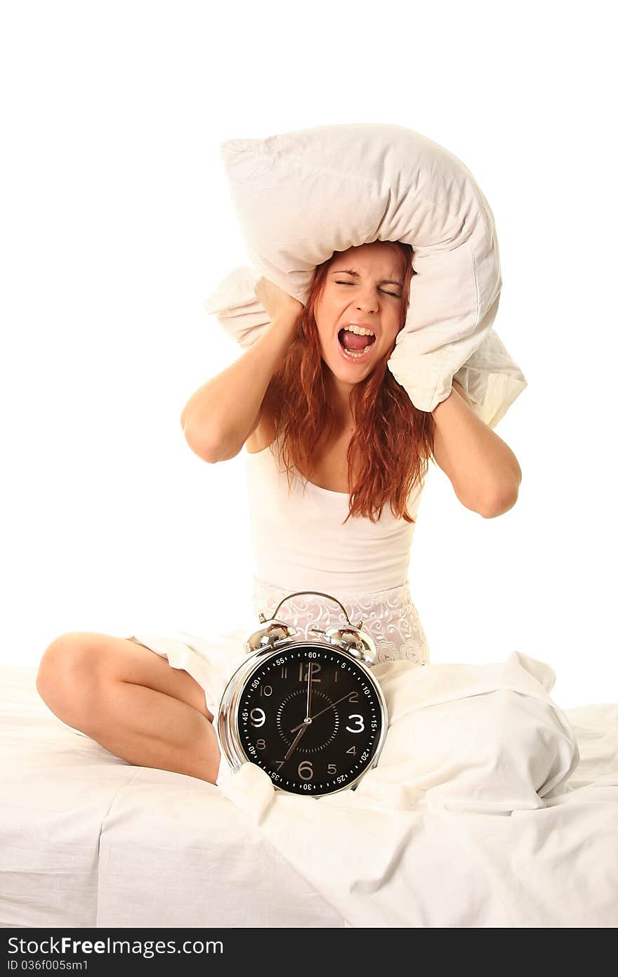 Young woman lying in bed with alarm clock. Young woman lying in bed with alarm clock