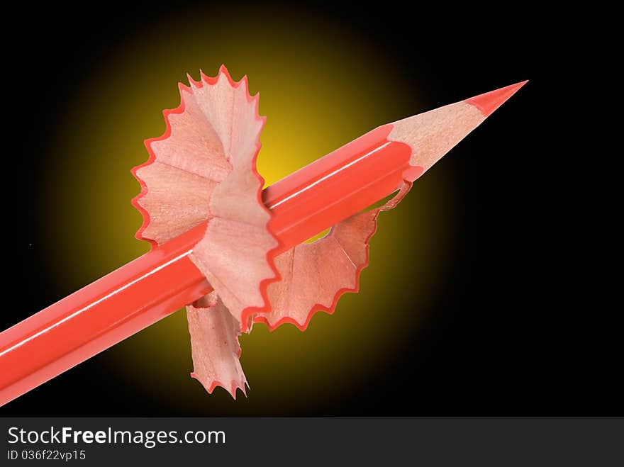 Red pencil with a shaving on a beautiful dark background. Red pencil with a shaving on a beautiful dark background.