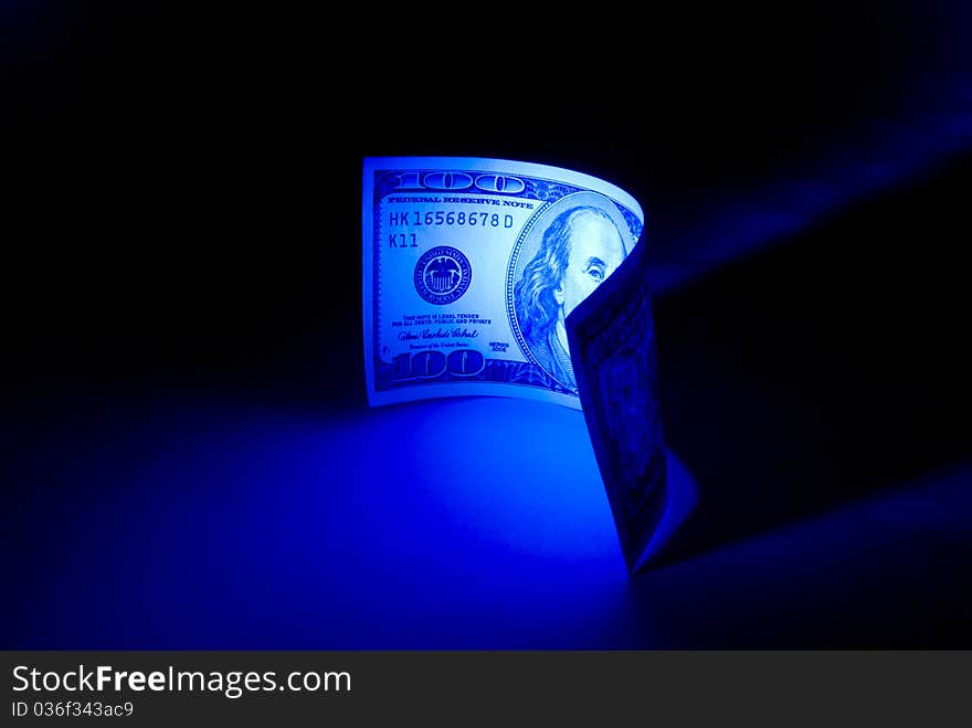 Hundred dollars. 
Beautiful art illumination. A dark blue background. Hundred dollars. 
Beautiful art illumination. A dark blue background.