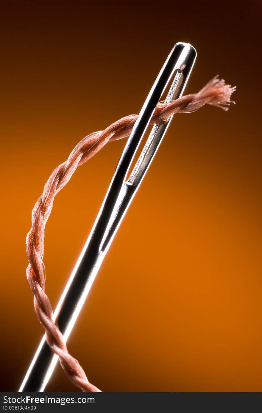 Metal needle and string. Very much a close up.
Art background. Metal needle and string. Very much a close up.
Art background.