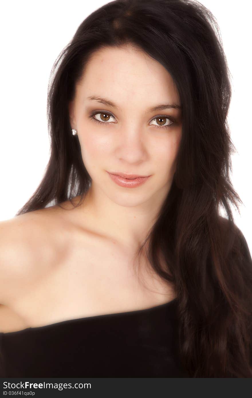 A portrait of a beautiful brunette woman in a black dress. A portrait of a beautiful brunette woman in a black dress.