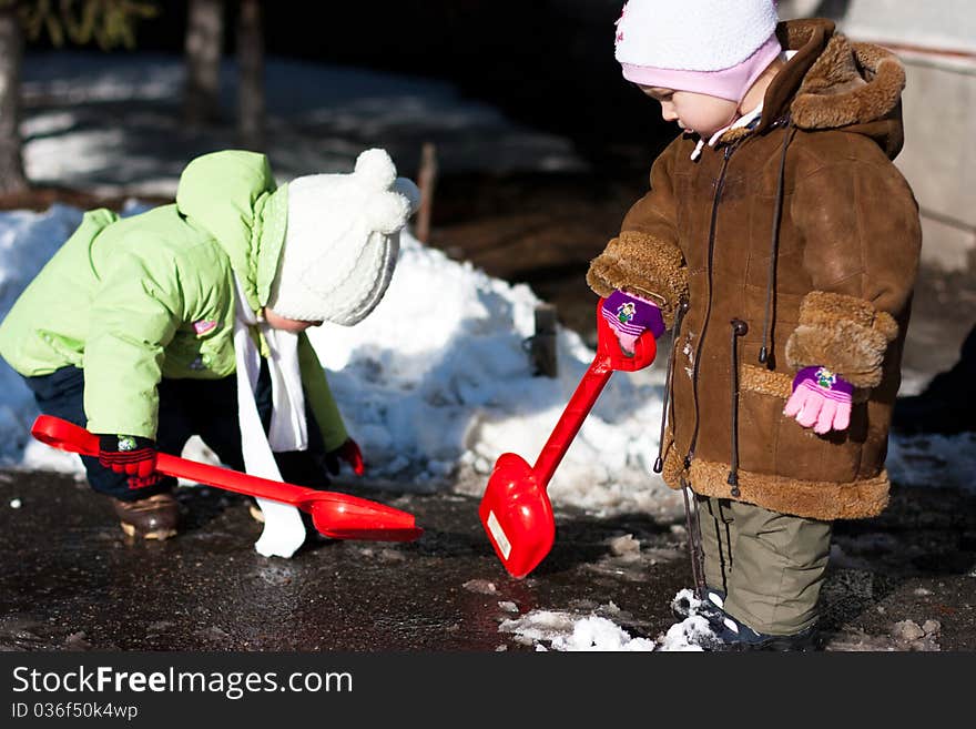 Childrenl playing  in winter