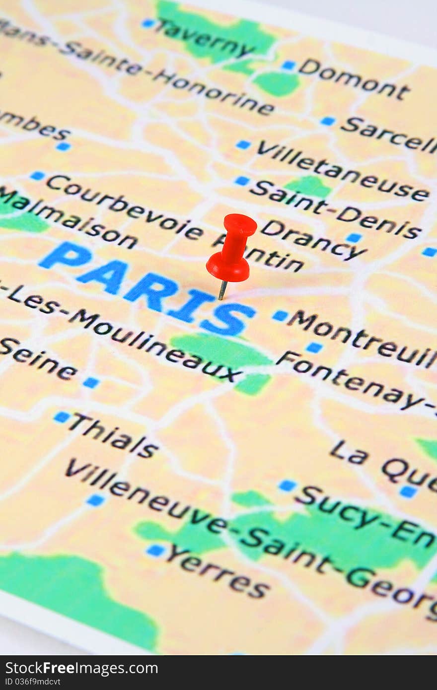 A paris map with a push pin