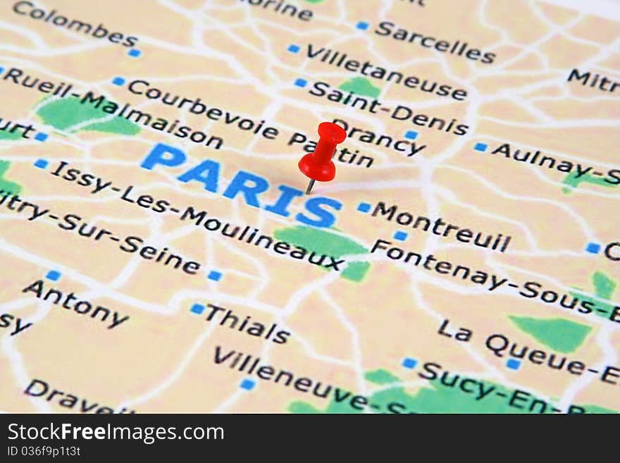 A paris map with a push pin