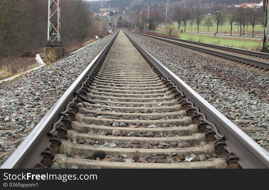 Railways on a stone platform, rails, road