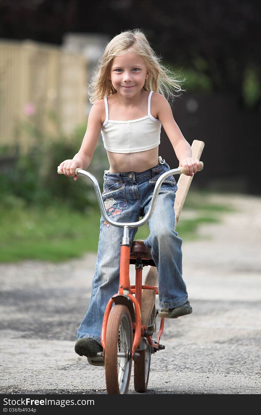 Young girl rides her bicylce