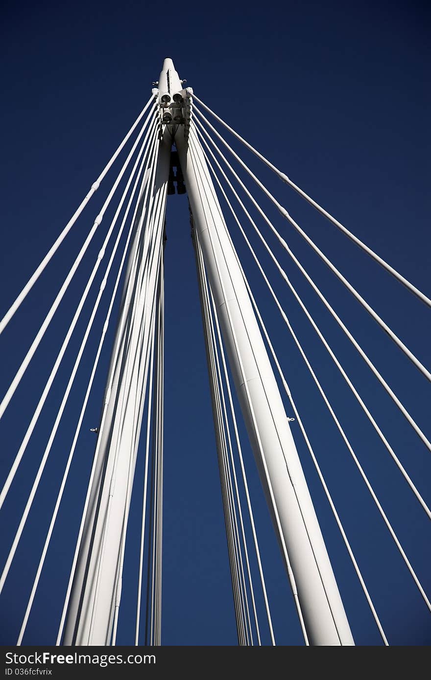 White columns and strings of a bridge