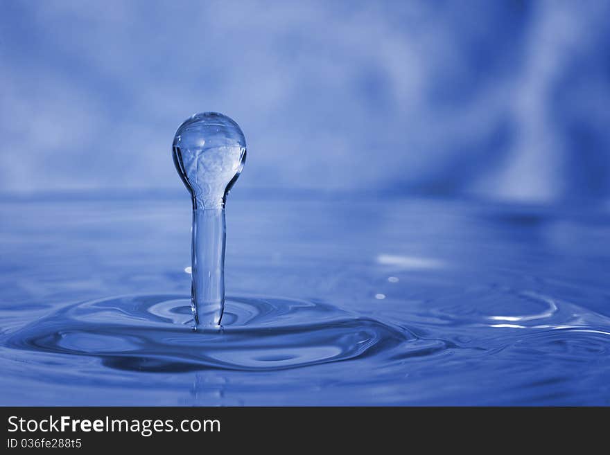 Blue water drop caught in action. Blue water drop caught in action