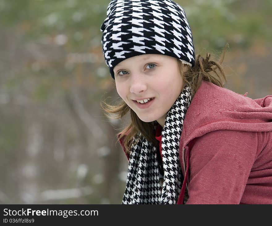 Young girl outside in the winter snow. Young girl outside in the winter snow