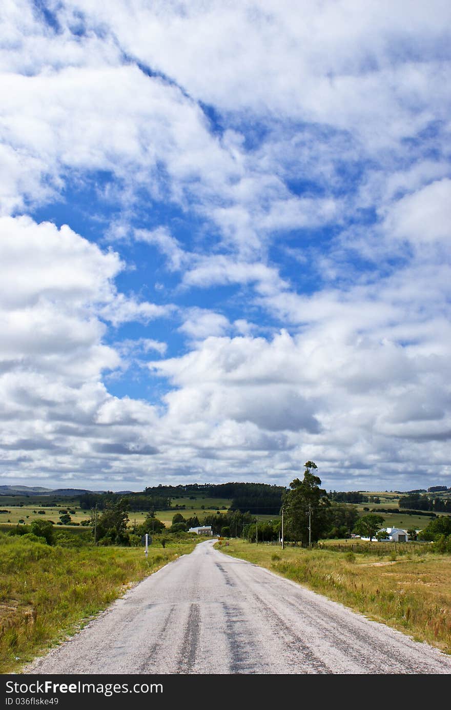 Route under a blue sky with white clouds. Route under a blue sky with white clouds