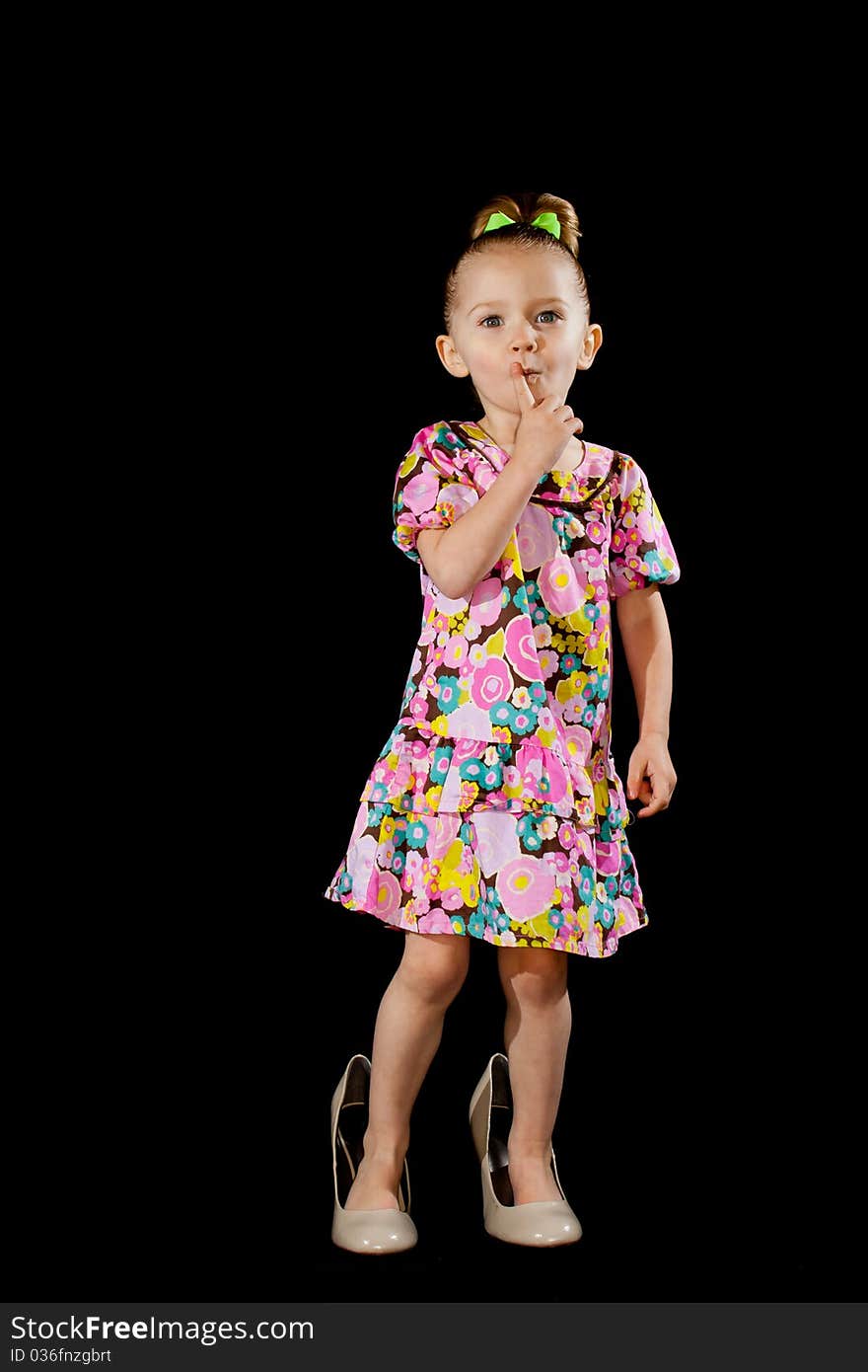 A cute little girl dressed up like an adult. She is wearing full sized shoes to add to the cuteness factor!. A cute little girl dressed up like an adult. She is wearing full sized shoes to add to the cuteness factor!