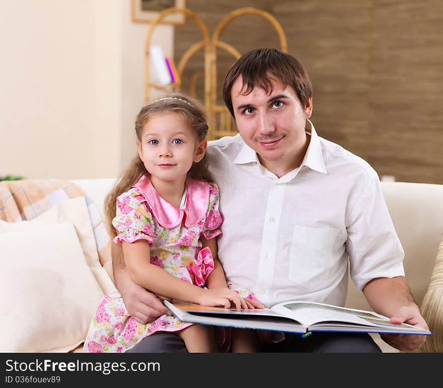 Young family at home with a daughter