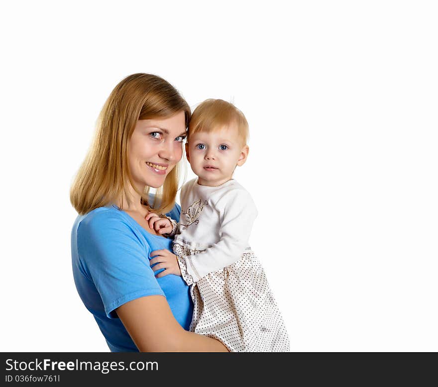 Young mother having fun with her little son on the floor