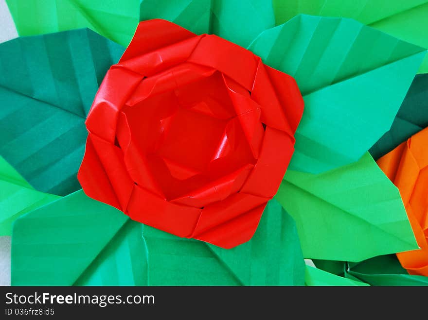 Paper flower, or origami folded and shaped in rose. Paper flower, or origami folded and shaped in rose