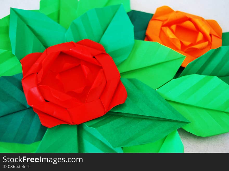 Paper flower, or origami folded and shaped in rose. Paper flower, or origami folded and shaped in rose