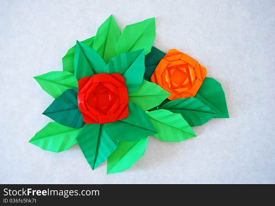 Paper flower, or origami folded and shaped in rose. Paper flower, or origami folded and shaped in rose