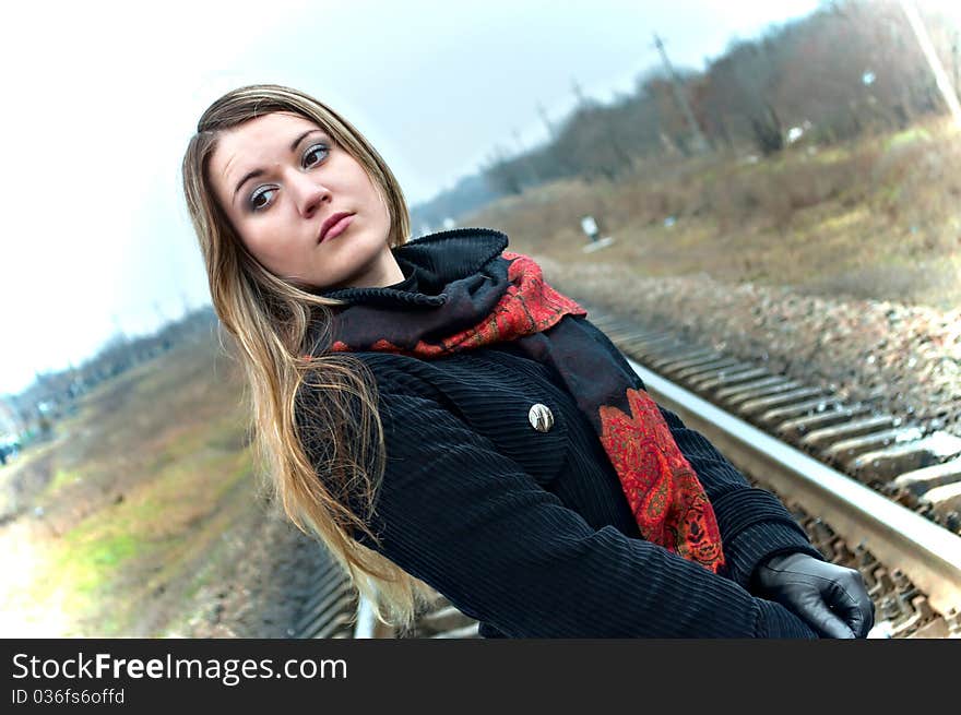 Portrait of the beautiful girl against the railway. Portrait of the beautiful girl against the railway