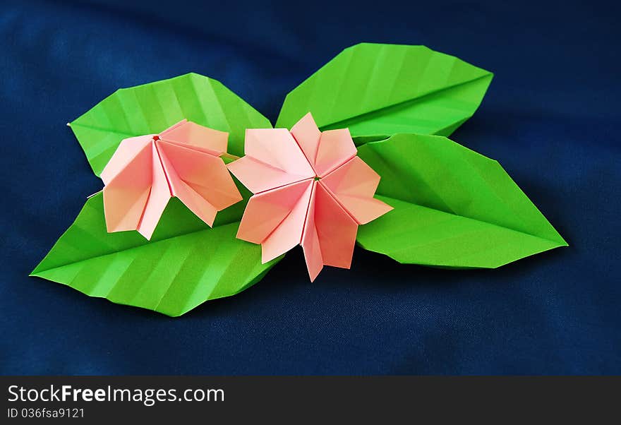 Paper flower, or origami folded and shaped in sakura. Paper flower, or origami folded and shaped in sakura