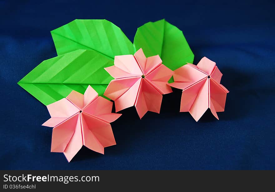 Paper flower, or origami folded and shaped in sakura. Paper flower, or origami folded and shaped in sakura