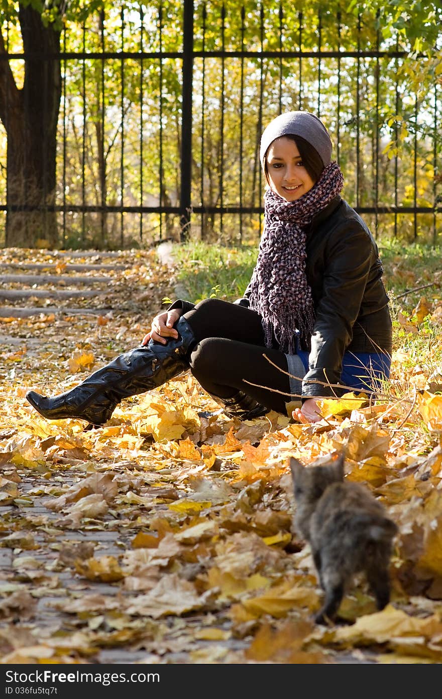 Young girl with a cat outdoors