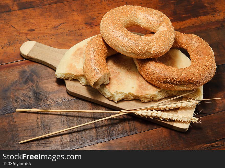 Still-life with bread and stalks of wheat