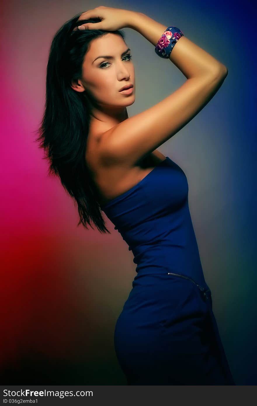 Attractive colorful brunette girl in blue dress