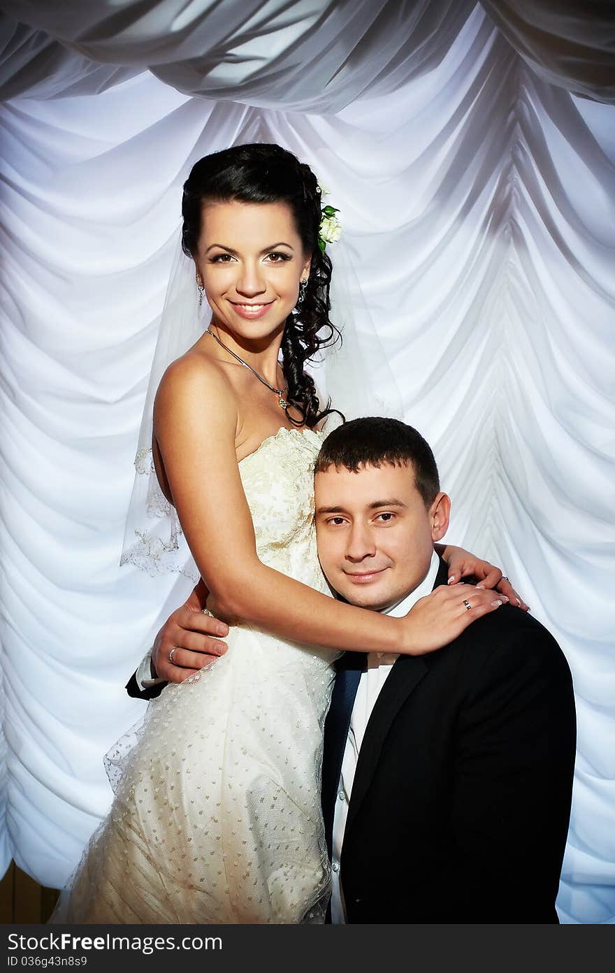 Happy bride and groom on wedding photo shoot