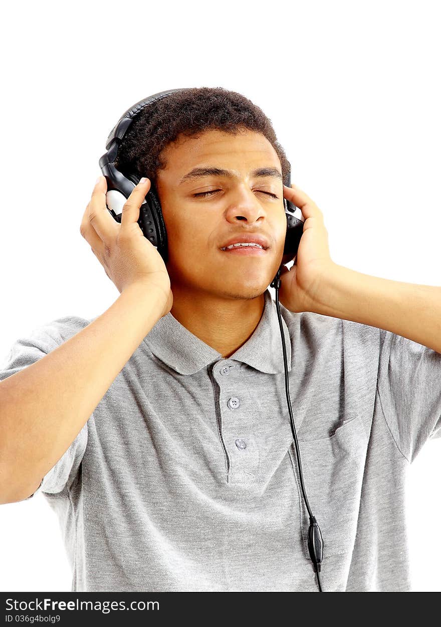 Young happy man listening to music