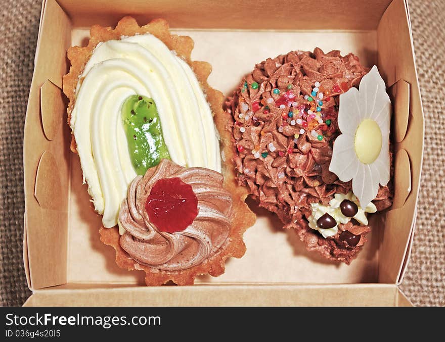 Two sweet cake into the box. Two sweet cake into the box.