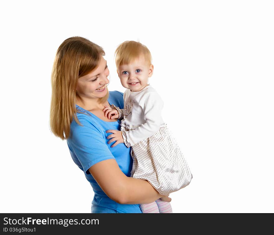 Young mother having fun with her little son on the floor