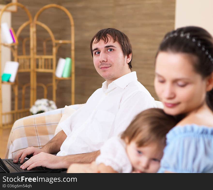 Young mother with a daughter at home