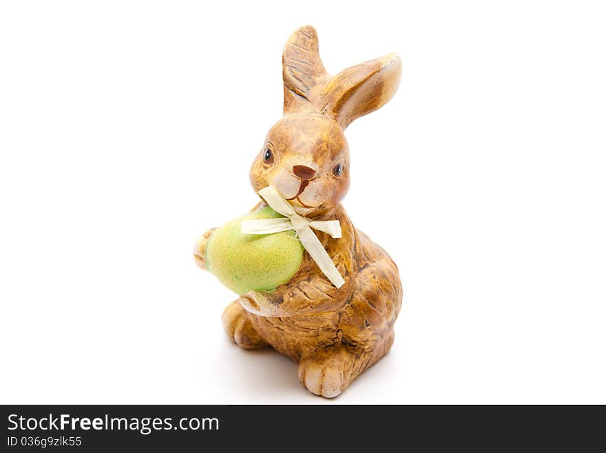 Easter bunny from ceramics with egg